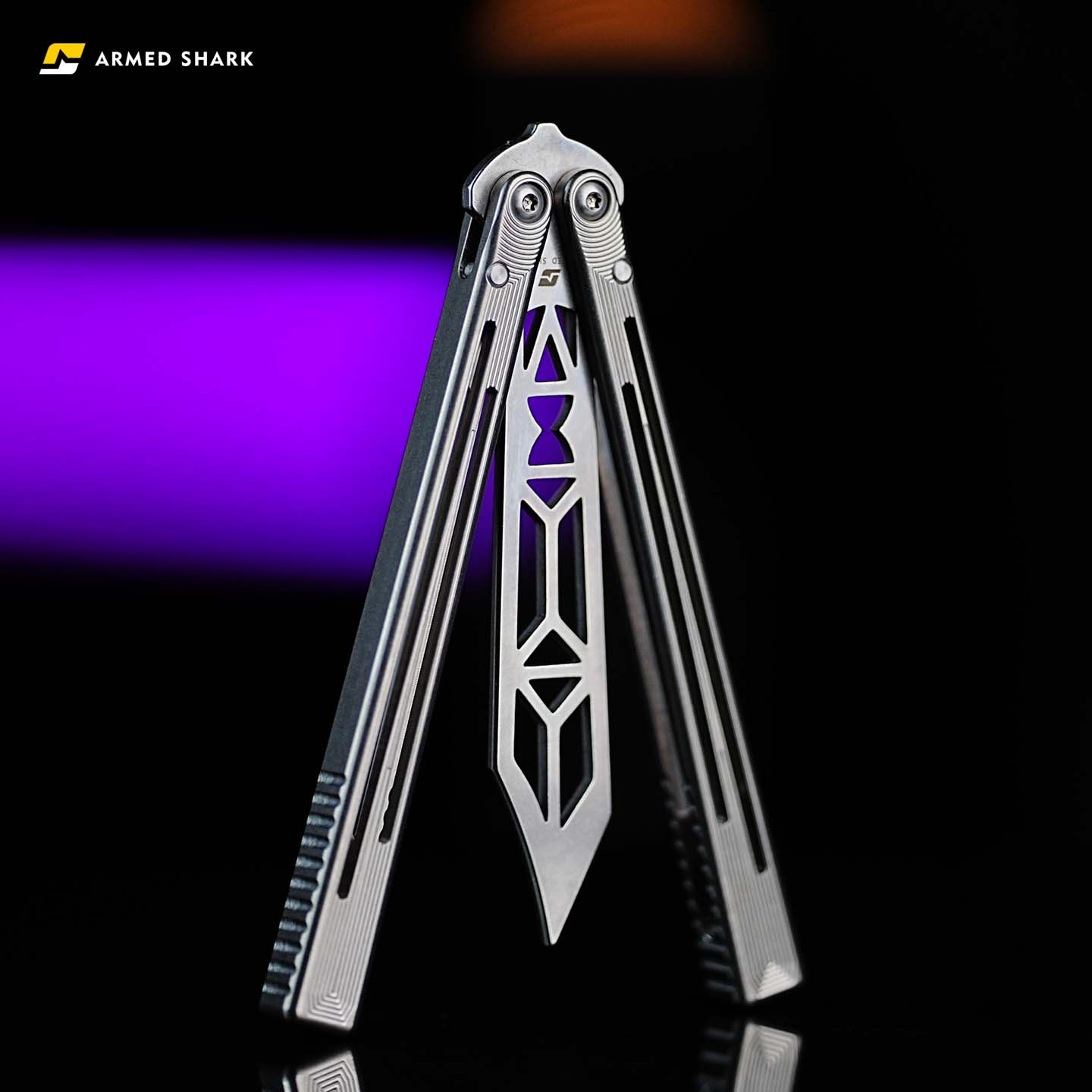 Armed Shark Titanium Alloy REP/SE Special Edition trainer displayed in an open position showing symmetrical handles, geometric blade design, and anti-slip grooves