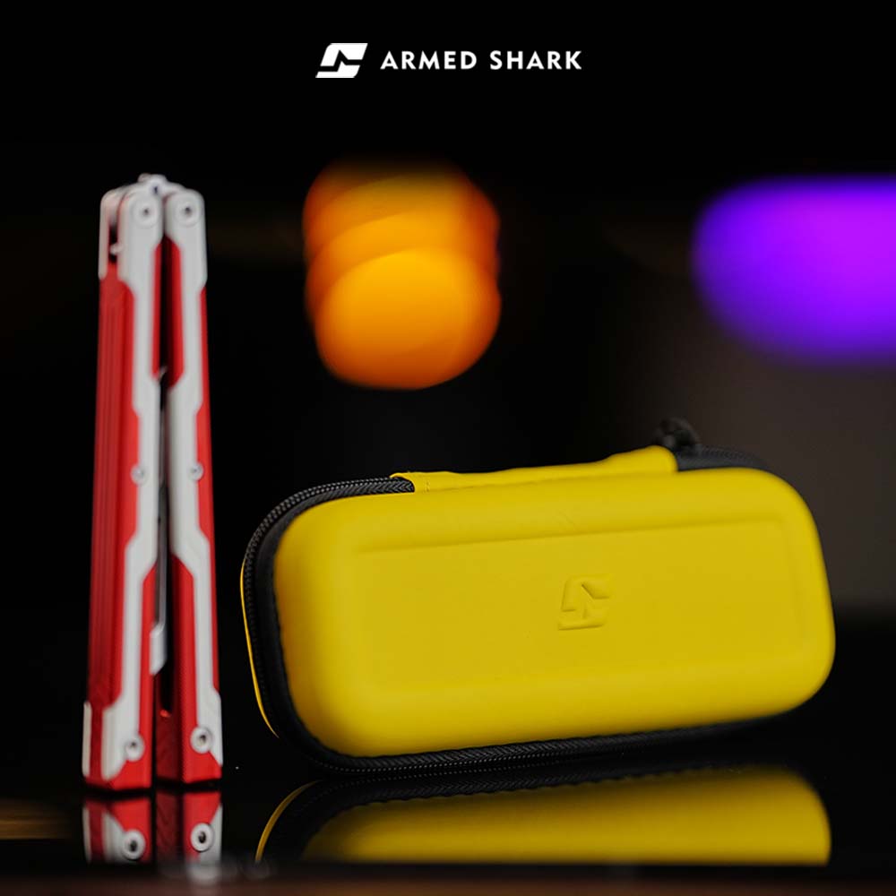 Armed Shark Ajax Series trainer displayed with yellow protective storage case
