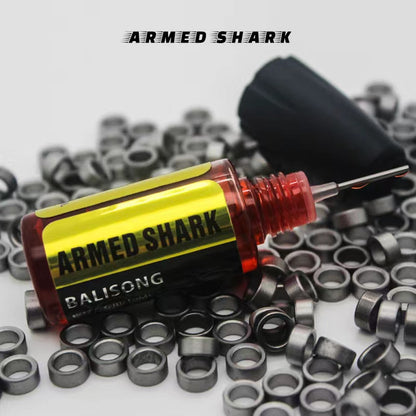 Armed Shark balisong lubricant oil bottle placed with maintenance tools