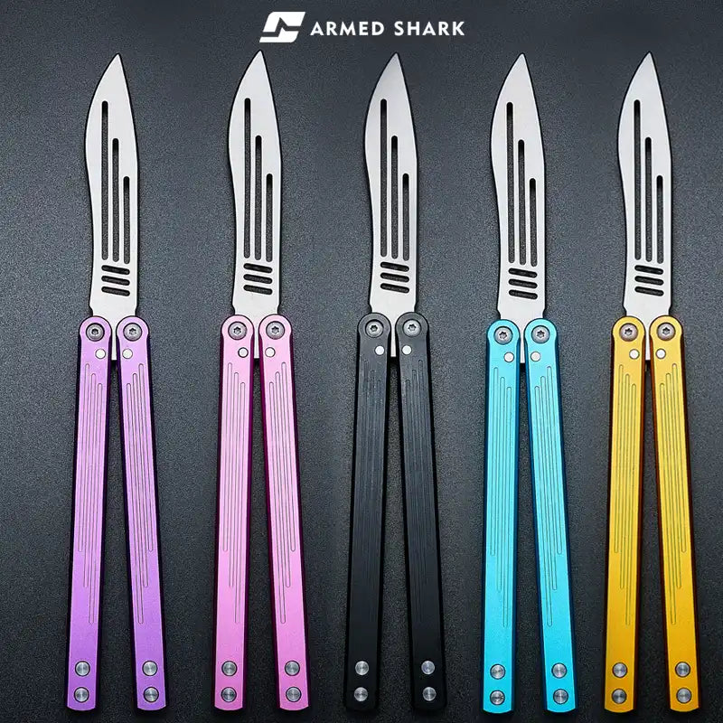 Armed Shark Balisong Trainer set in purple, pink, black, blue, and gold handles – group lineup view.