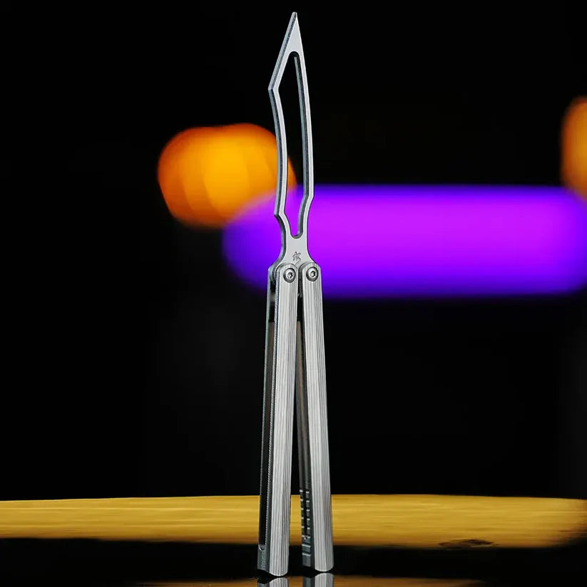 Angled open view of Armed Shark CK-DR trainer with titanium handles and skeletonized blade