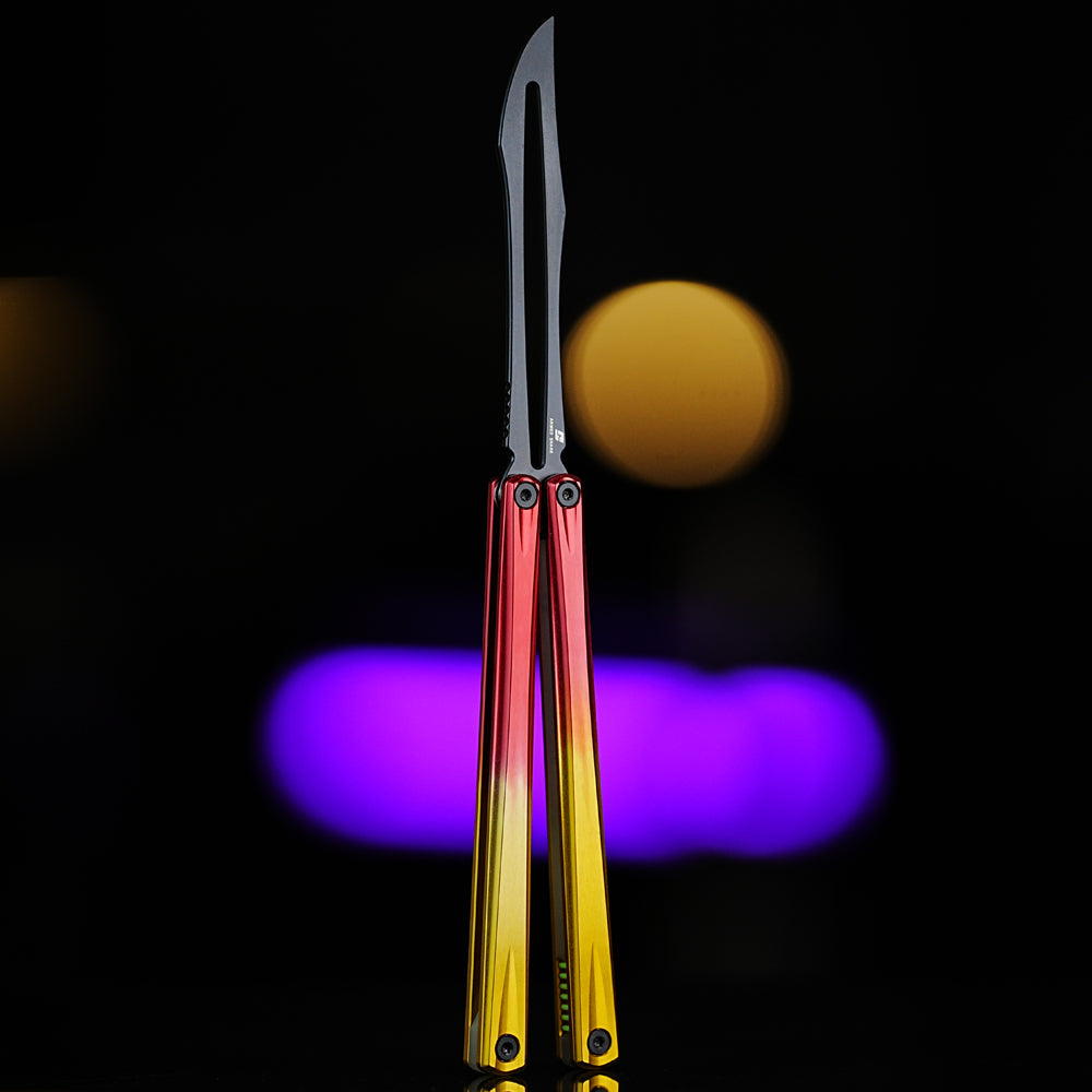 Front view of Armed Shark Eureka Balisong Trainer in red-yellow gradient finish with black training edge, featuring polished aluminum handles and CNC-machined construction under studio lighting