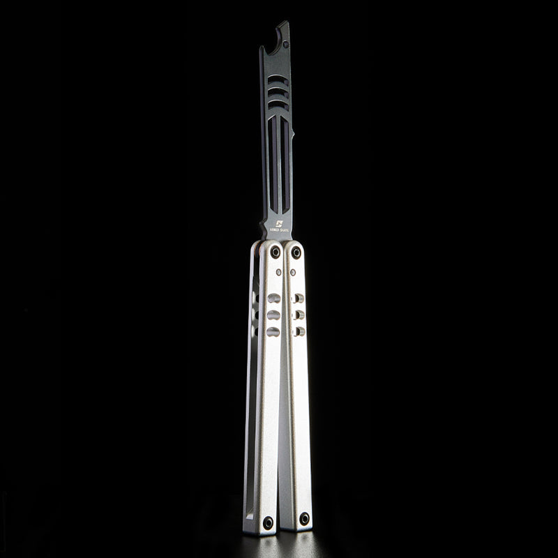 Armed Shark Inked Mako bottle-opener balisong trainer with black training edge and silver handles, front view on black background.