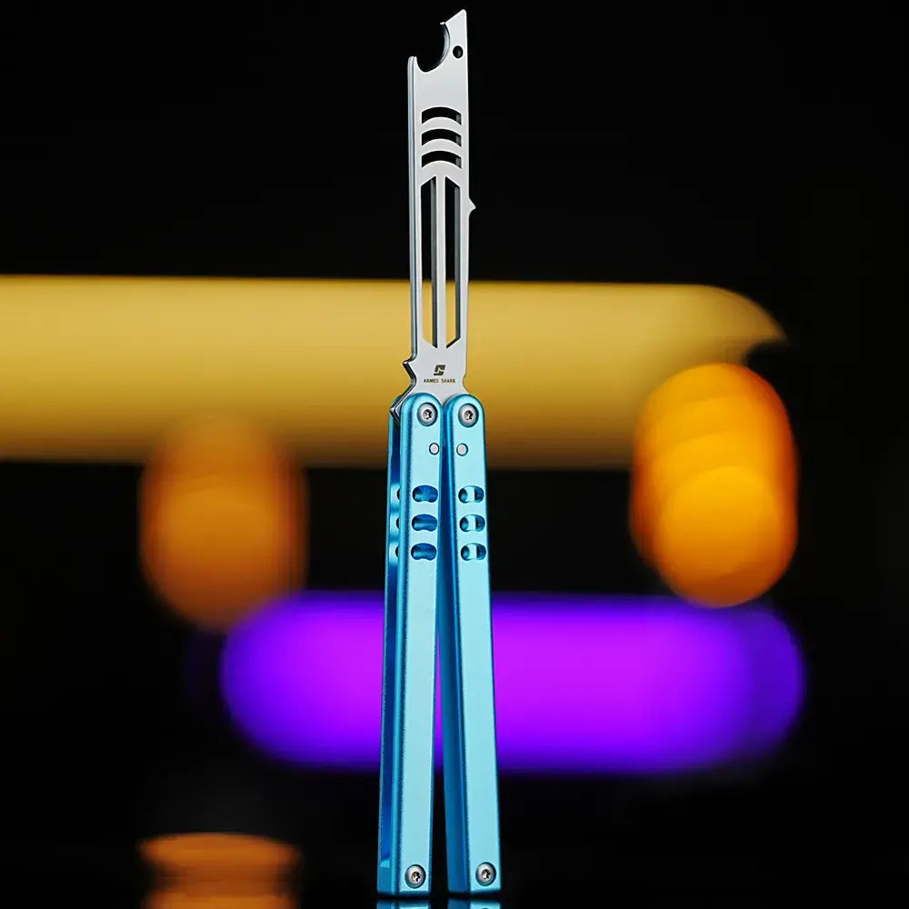 Armed Shark Inked Mako bottle-opener balisong trainer with silver training edge and blue gradient handles, front view, studio background.