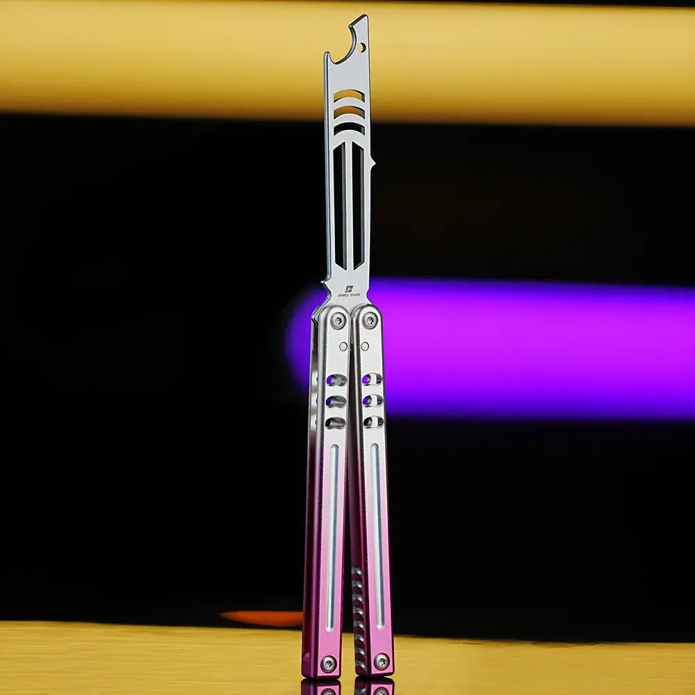 Armed Shark Inked Mako bottle-opener balisong trainer with silver training edge and silver-pink gradient handles, front view, studio background.