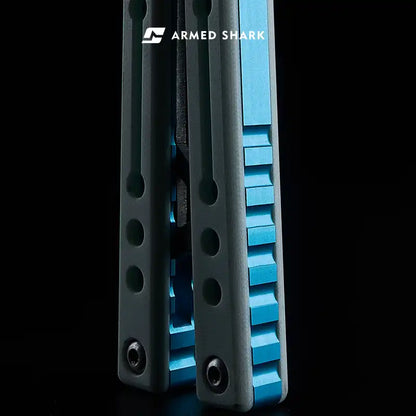 Armed Shark Nautilus v2 Balisong Trainer black handle with blue liner detail close-up