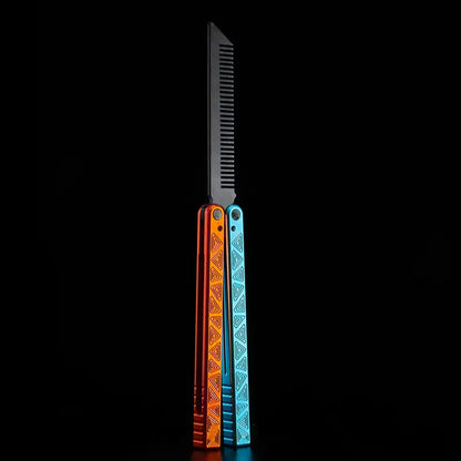 Armed Shark Original balisong style comb trainer with orange and blue engraved handles in open view