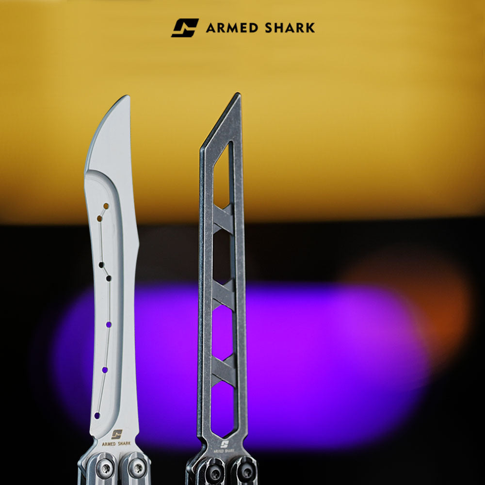 Armed Shark Prism Balisong Trainer blade close-up showing unsharpened stainless edge and skeletonized design