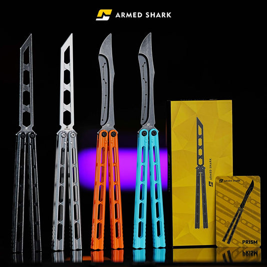 Armed Shark Prism Balisong Trainer full color lineup including silver black orange and blue variants with branded packaging