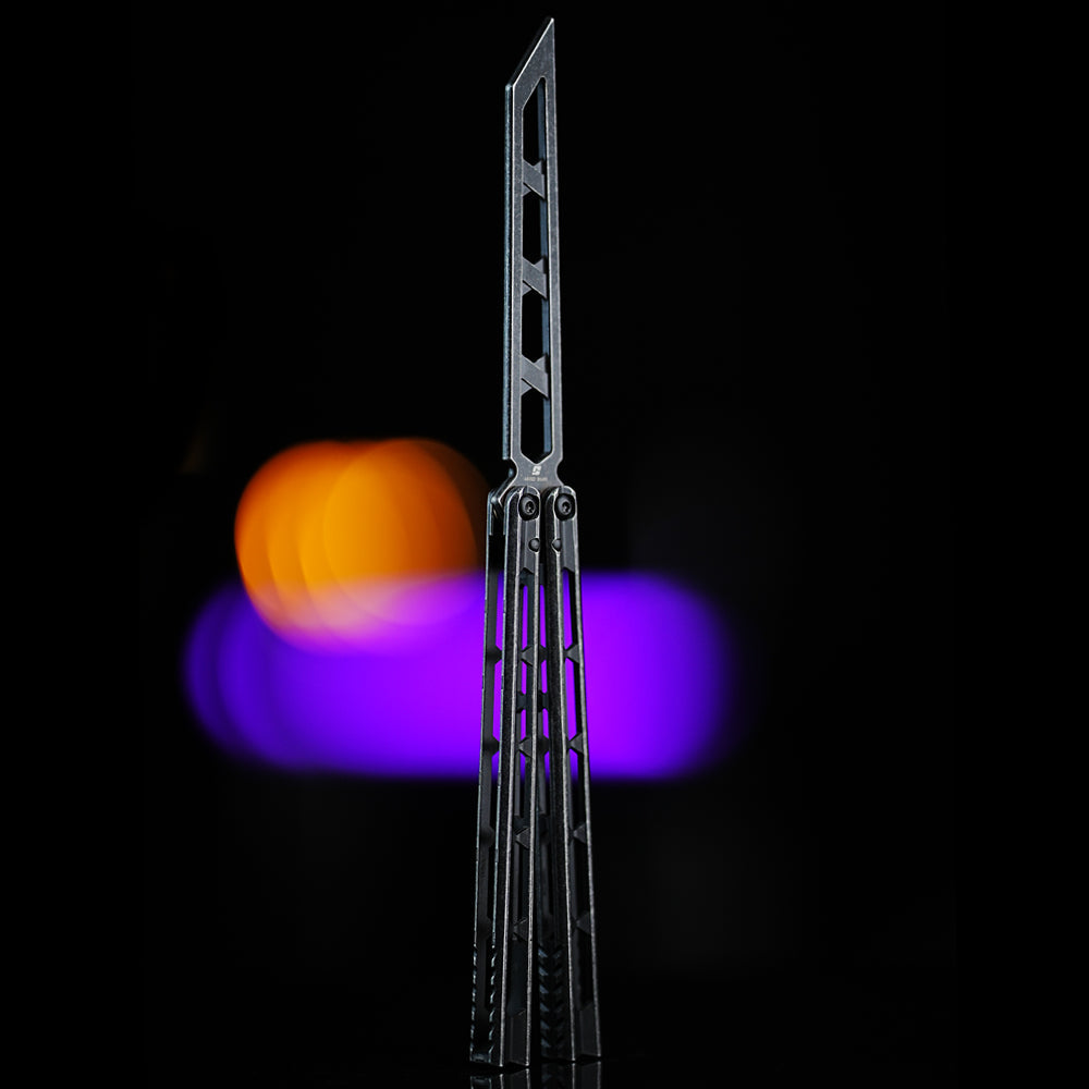 Armed Shark Prism Balisong Trainer skeleton blade version in black handles highlighting lightweight design and precision build