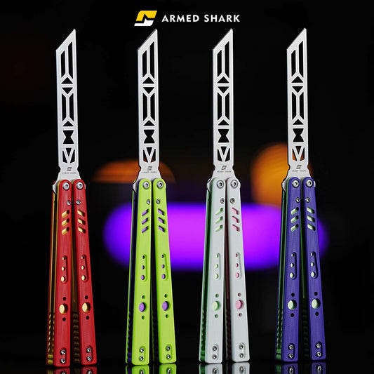 Armed Shark REP V2 Butterfly Trainer lineup in red, green, white, and blue G10 handle colors under studio lighting