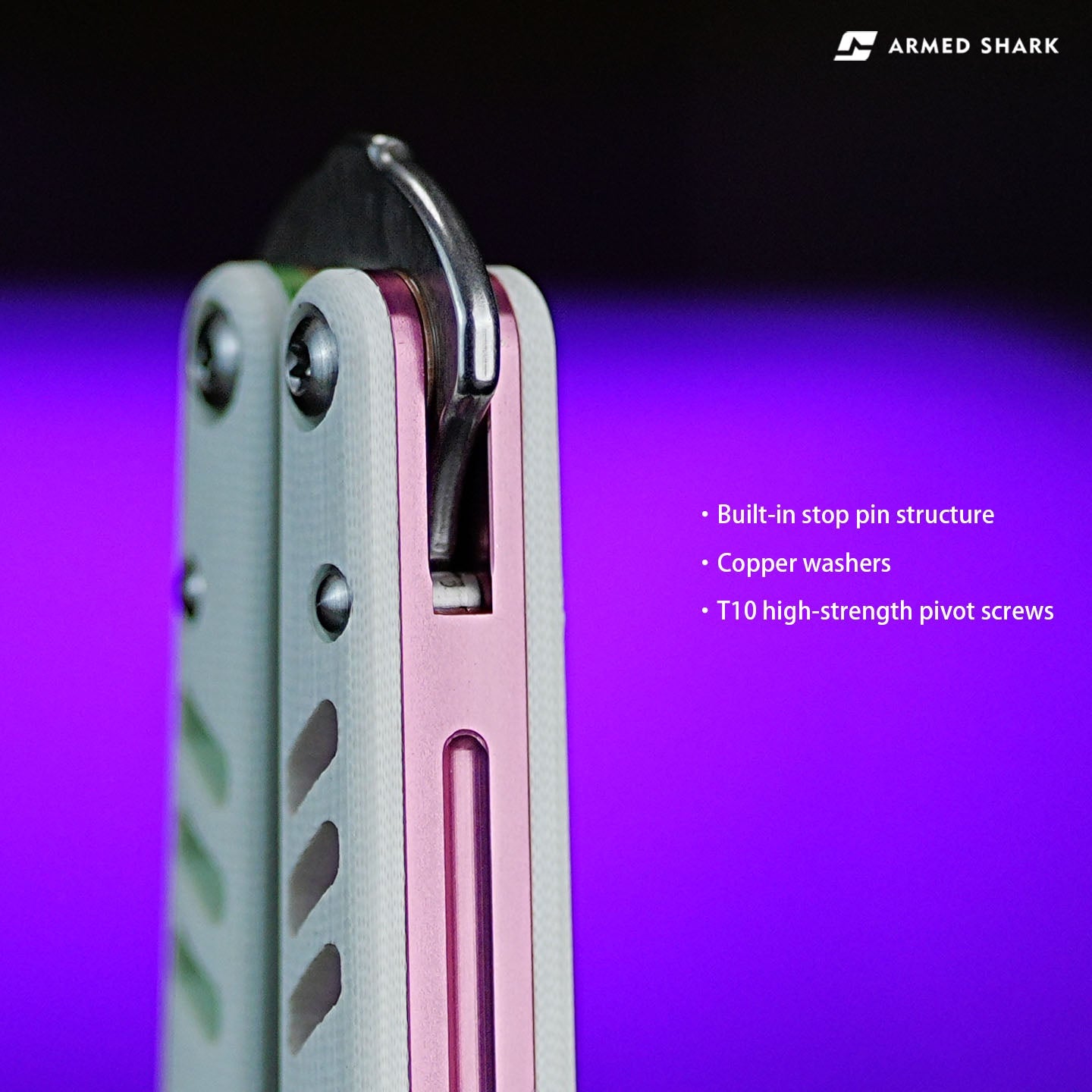 Close-up of Armed Shark REP V2 Butterfly Trainer with white and pink handle showing built-in stop pin, copper washers, and T10 pivot screws