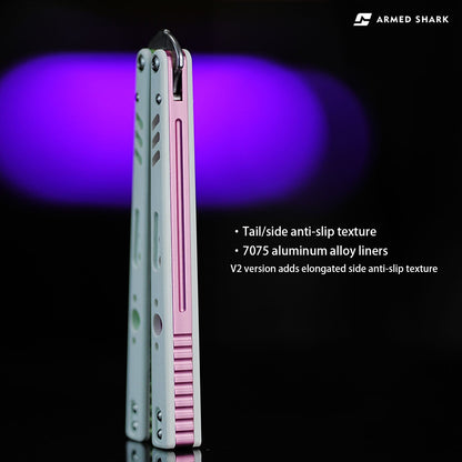 Side view of Armed Shark REP V2 Butterfly Trainer with white and pink G10 handle scales showing anti-slip texture and 7075 aluminum liners