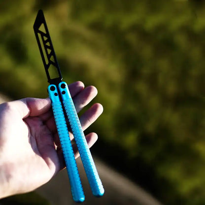 Armed Shark Sahara Butterfly Trainer with blue aluminum handle held in hand outdoors