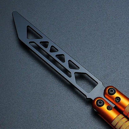 Close-up view of Armed Shark Sahara Butterfly Trainer with orange aluminum handle and black training edge