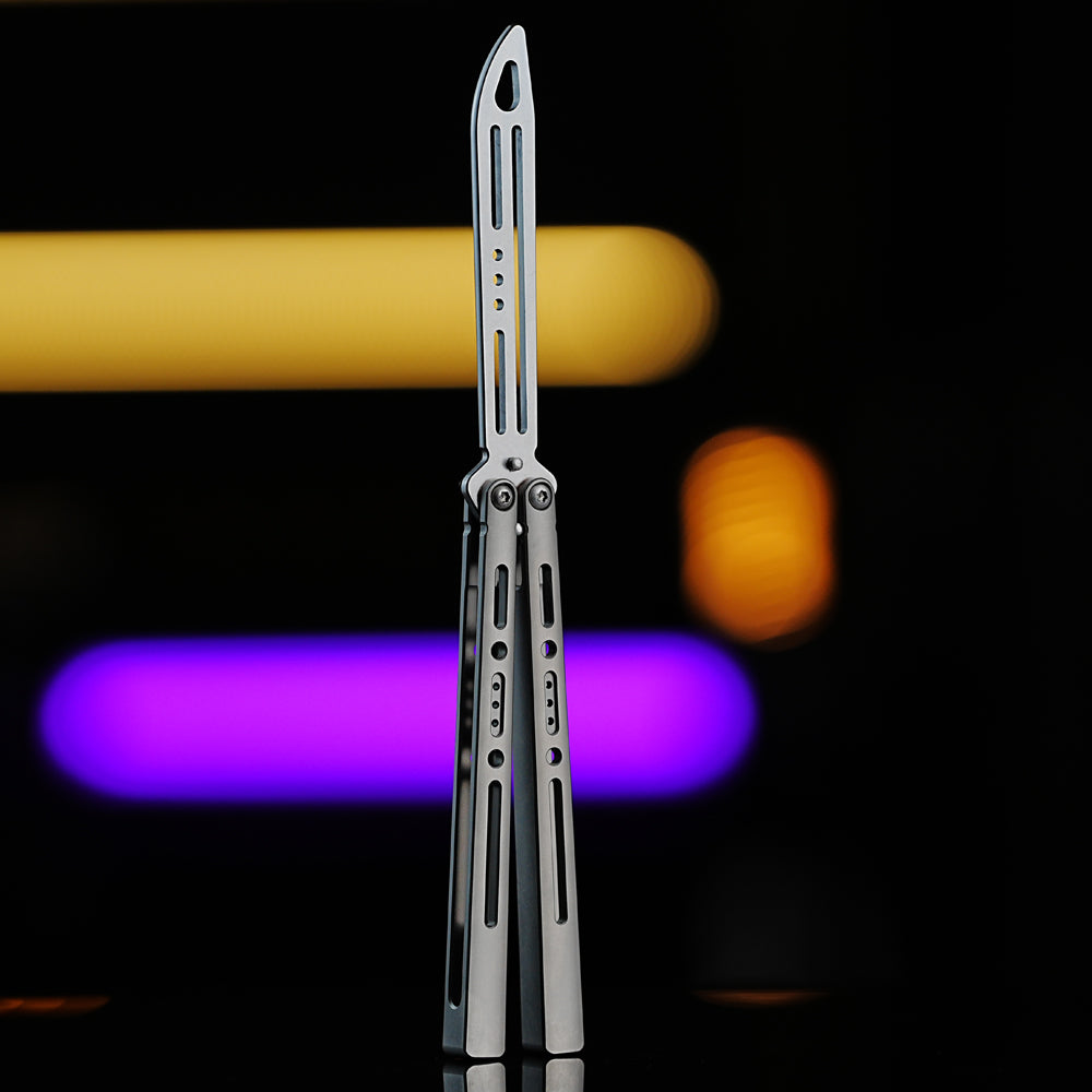 Armed Shark Sentinel TC4 titanium alloy balisong trainer butterfly with silver stonewash finish, CNC machined for precision flipping practice.