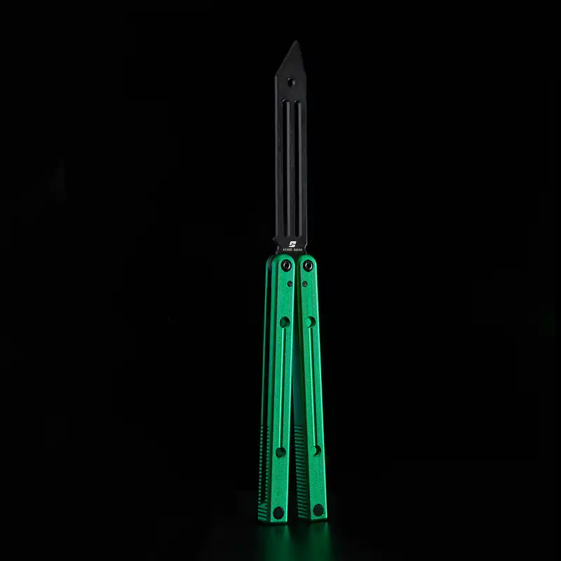 Armed Shark Squidtrainer V4 7075 aluminum balisong trainer with black slotted training head and green handles, front view on black background.