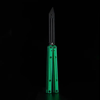Armed Shark Squidtrainer V4 7075 aluminum balisong trainer with black slotted training head and green handles, front view on black background.
