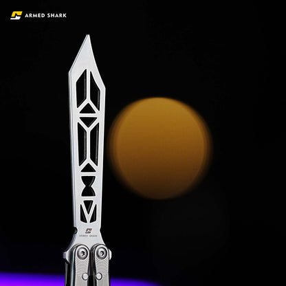 Close-up view of the Armed Shark Titanium Alloy REP/SE Special Edition trainer blade showing geometric cutouts and stonewashed finish under soft lighting